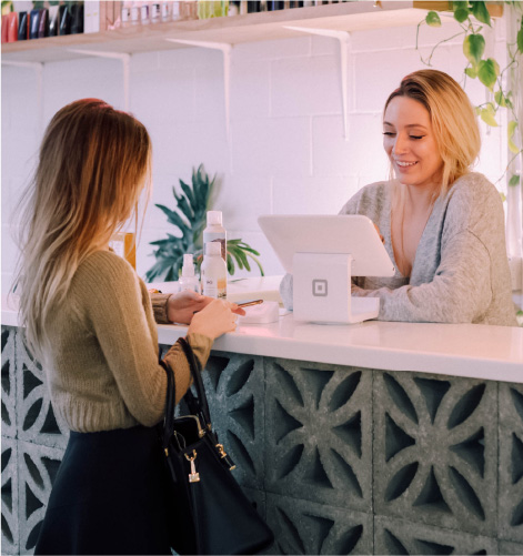 Two women in a retail store.